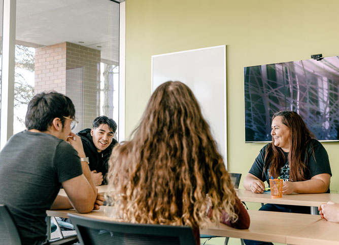 Group of students sitting in Des Plaines student center.